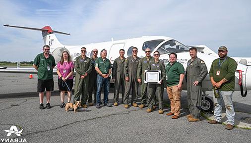 College staff receive Air Force T-1A trainer jets from members of the US Air Force